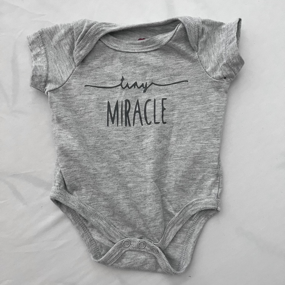 Grey NB onesie slightly worn
